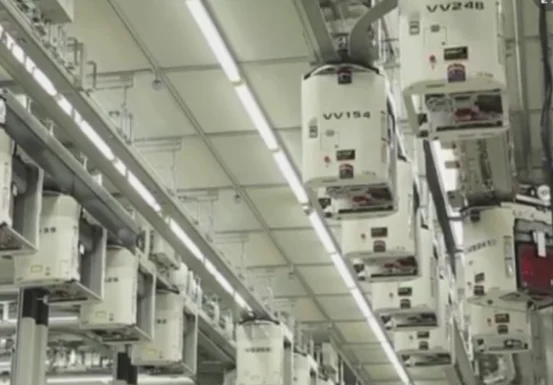 Overhead Hoist Transport vehicles on a ceiling track in a fab